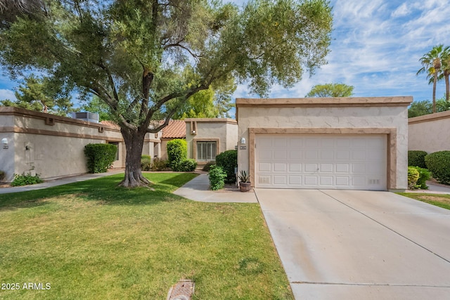 9128 W Kimberly Way, Peoria, AZ 85382 - view of front of property with concrete driveway, a front lawn, an attached garage, and stucco siding