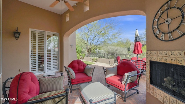 view of patio featuring ceiling fan and outdoor lounge area