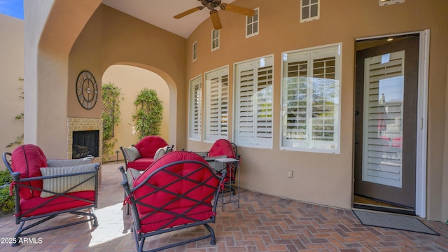 view of patio with ceiling fan, visible vents, and an outdoor living space