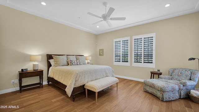 bedroom featuring wood-type flooring, baseboards, a ceiling fan, and recessed lighting