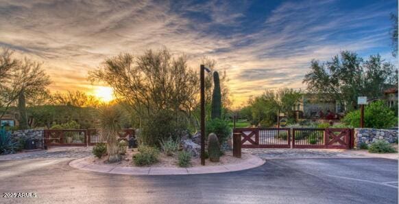 exterior space with a gate and a gated entry