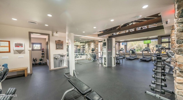 gym featuring recessed lighting, a healthy amount of sunlight, and visible vents