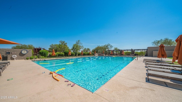 community pool featuring a patio area