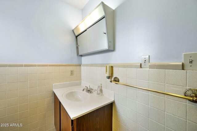 2235 W Mendiburo Way, Prescott, AZ 86305 - bathroom featuring a wainscoted wall, vanity, and tile walls