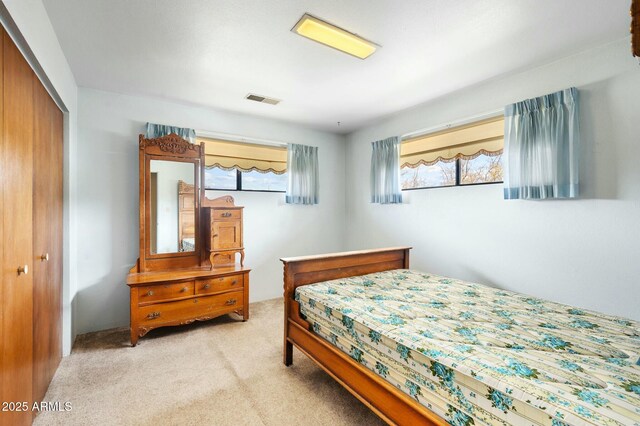 2235 W Mendiburo Way, Prescott, AZ 86305 - bedroom with a closet, visible vents, multiple windows, and light carpet