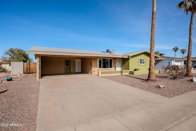 ranch-style home with a carport