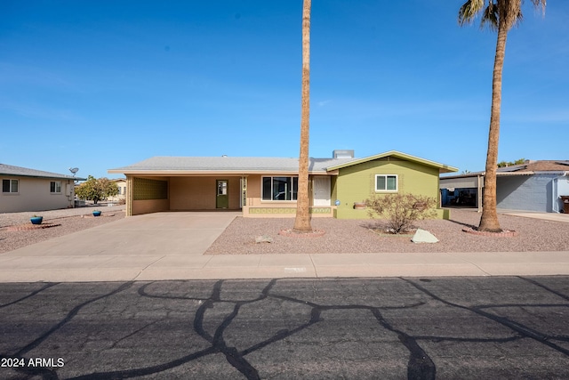 single story home with a carport