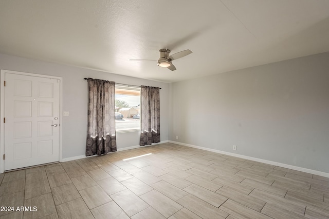 spare room with ceiling fan