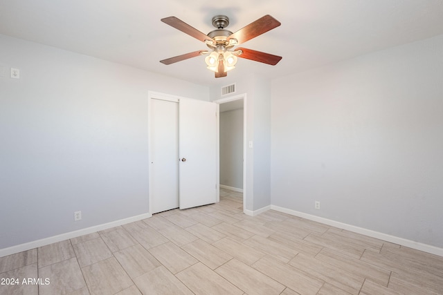 unfurnished room with ceiling fan