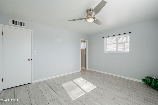 spare room with ceiling fan