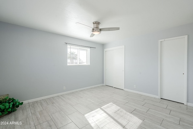 unfurnished bedroom featuring ceiling fan