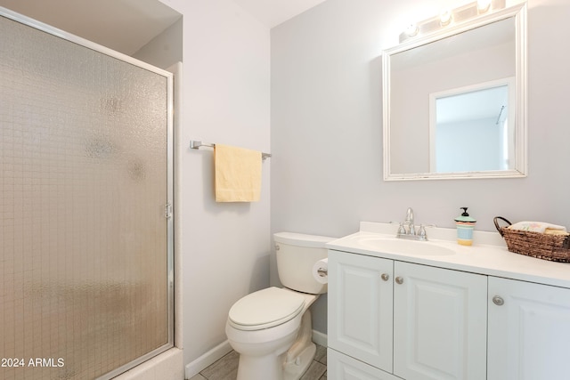 bathroom with vanity, toilet, and walk in shower