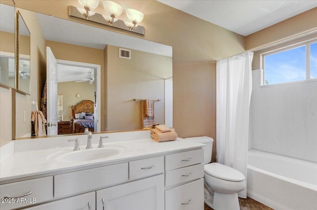 full bathroom featuring vanity, toilet, and shower / tub combo