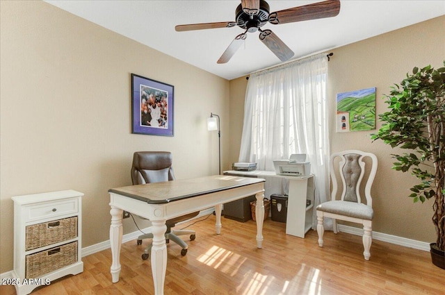 office with ceiling fan and light wood-type flooring