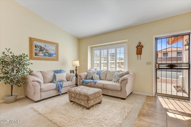 tiled living room with lofted ceiling