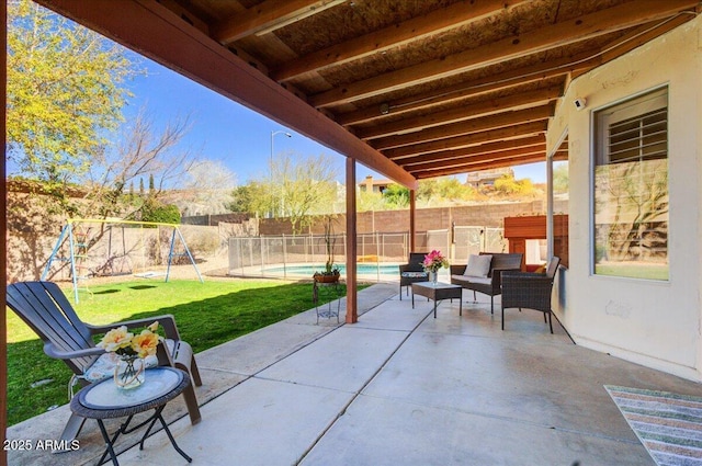 view of patio / terrace with a fenced in pool