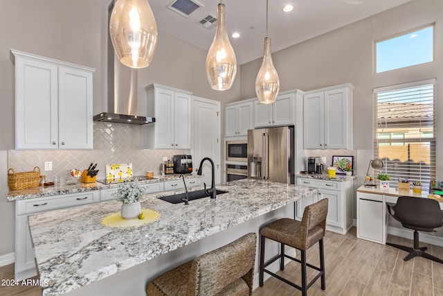 kitchen featuring backsplash, sink, wall chimney exhaust hood, and black appliances