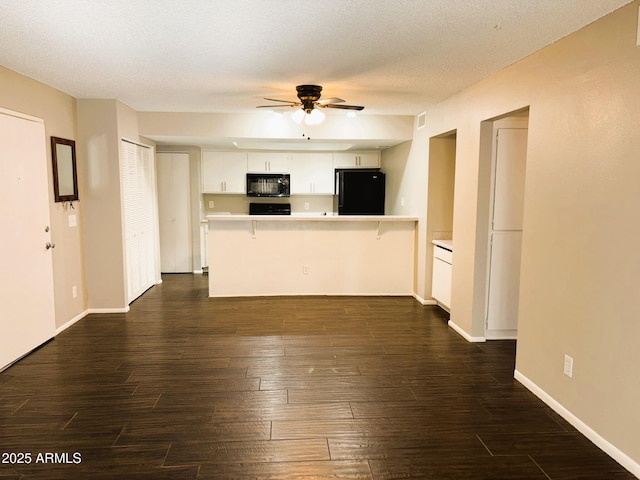1920 W Lindner Ave Unit 137, Mesa, AZ 85202 - unfurnished living room featuring a ceiling fan, dark wood finished floors, baseboards, and a textured ceiling