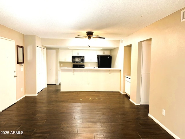 1920 W Lindner Ave Unit 137, Mesa, AZ 85202 - unfurnished living room featuring a ceiling fan, dark wood-style floors, a textured ceiling, and baseboards