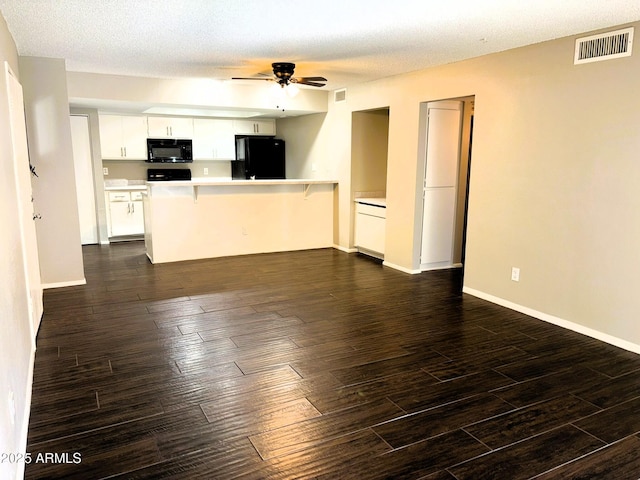 1920 W Lindner Ave Unit 137, Mesa, AZ 85202 - unfurnished living room featuring ceiling fan, dark wood-style flooring, baseboards, and a textured ceiling