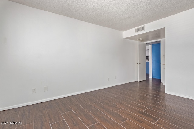 empty room featuring a textured ceiling