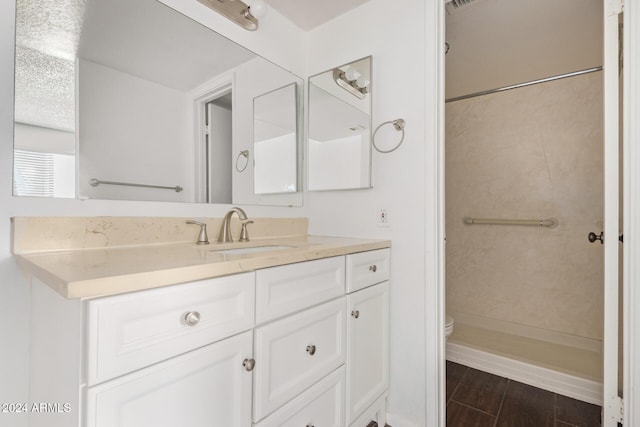 1920 W Lindner Ave Unit 137, Mesa, AZ 85202 - bathroom featuring vanity, toilet, a shower, and wood finished floors