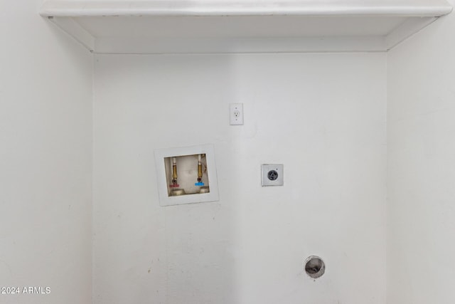 washroom with electric dryer hookup and hookup for a washing machine