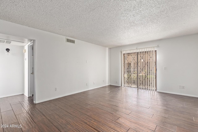 1920 W Lindner Ave Unit 137, Mesa, AZ 85202 - spare room featuring wood finished floors, a textured ceiling, and baseboards