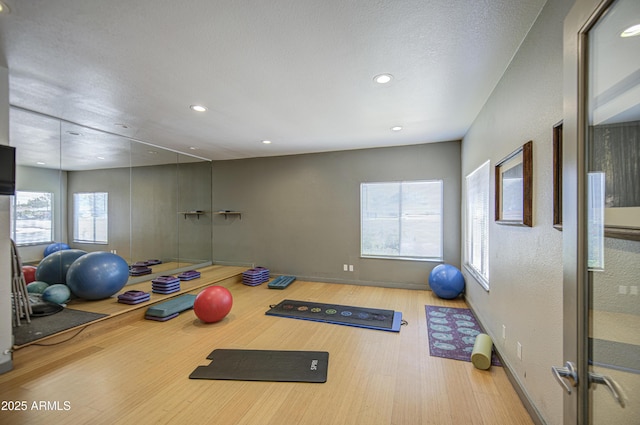3600 N Hayden Rd Unit 2310, Scottsdale, AZ 85251 - exercise room featuring wood finished floors, recessed lighting, and baseboards