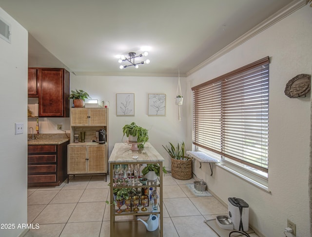 3600 N Hayden Rd Unit 2310, Scottsdale, AZ 85251 - dining room featuring crown molding and light tile patterned floors