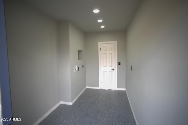 hall with recessed lighting and baseboards