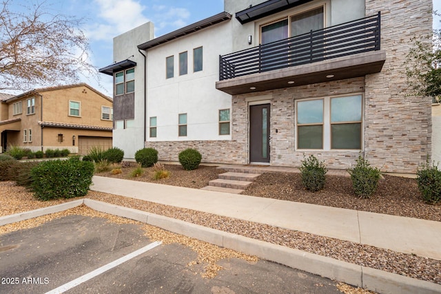 view of front of property with a balcony