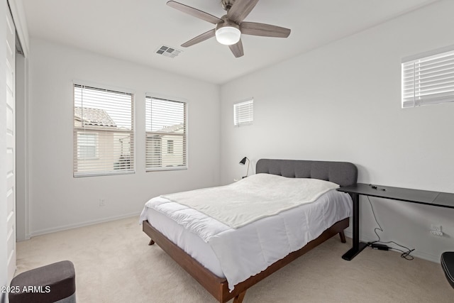 carpeted bedroom featuring ceiling fan