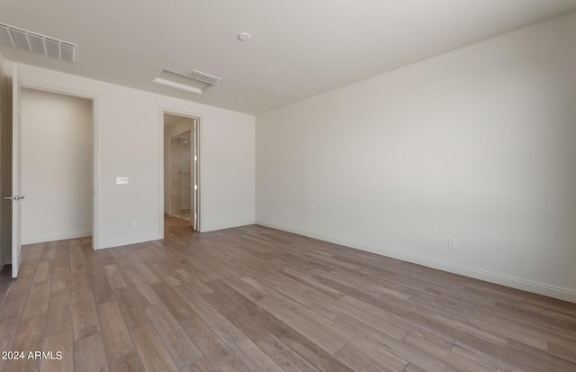 unfurnished bedroom featuring light wood-type flooring