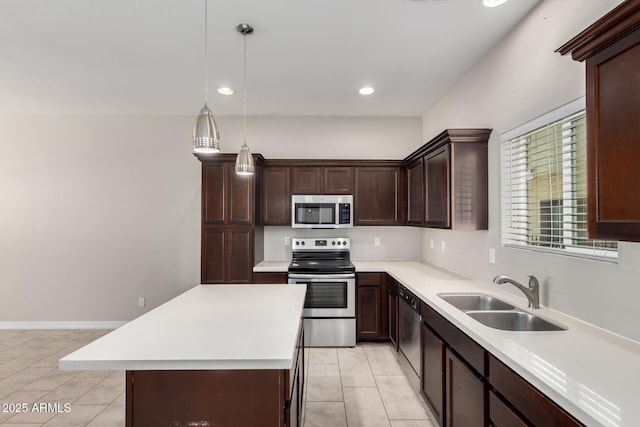2000 N 36th St Unit 19, Phoenix, AZ 85008 - kitchen with appliances with stainless steel finishes, light countertops, light tile patterned flooring, dark brown cabinets, and pendant lighting