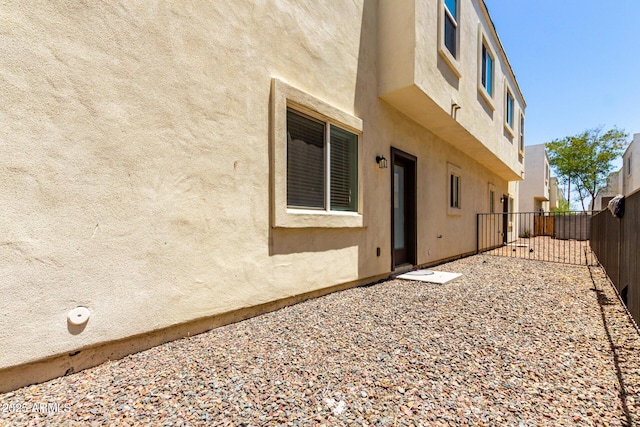 2000 N 36th St Unit 19, Phoenix, AZ 85008 - back of house featuring a fenced backyard and stucco siding