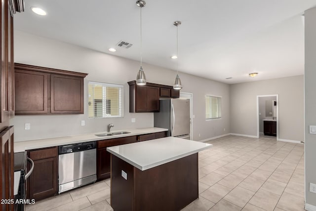 2000 N 36th St Unit 19, Phoenix, AZ 85008 - kitchen with appliances with stainless steel finishes, light tile patterned flooring, plenty of natural light, light countertops, and recessed lighting