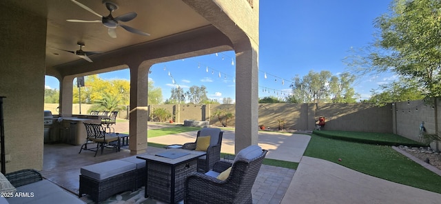 view of patio featuring ceiling fan, a fenced backyard, and a grill