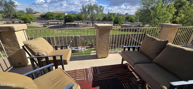 view of patio with an outdoor hangout area and a balcony