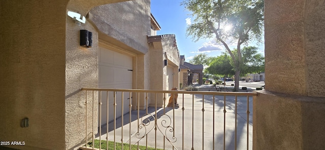 view of property exterior with a garage and stucco siding
