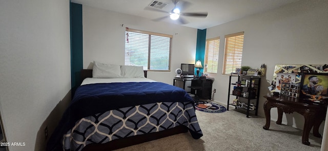 bedroom with carpet, visible vents, and ceiling fan