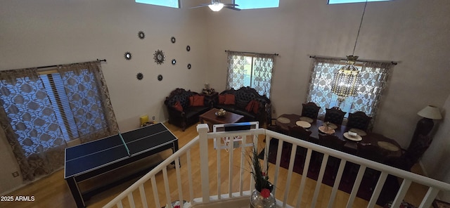 interior space with ceiling fan and wood finished floors