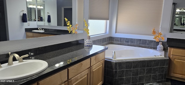 full bath with a bath and vanity