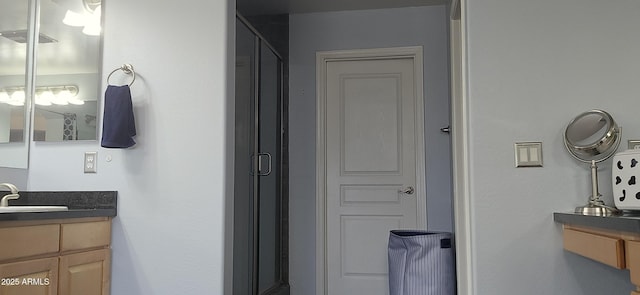 bathroom with vanity and an enclosed shower