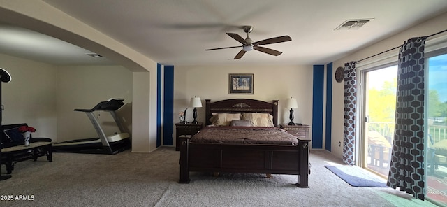 bedroom featuring arched walkways, visible vents, carpet, a ceiling fan, and access to outside