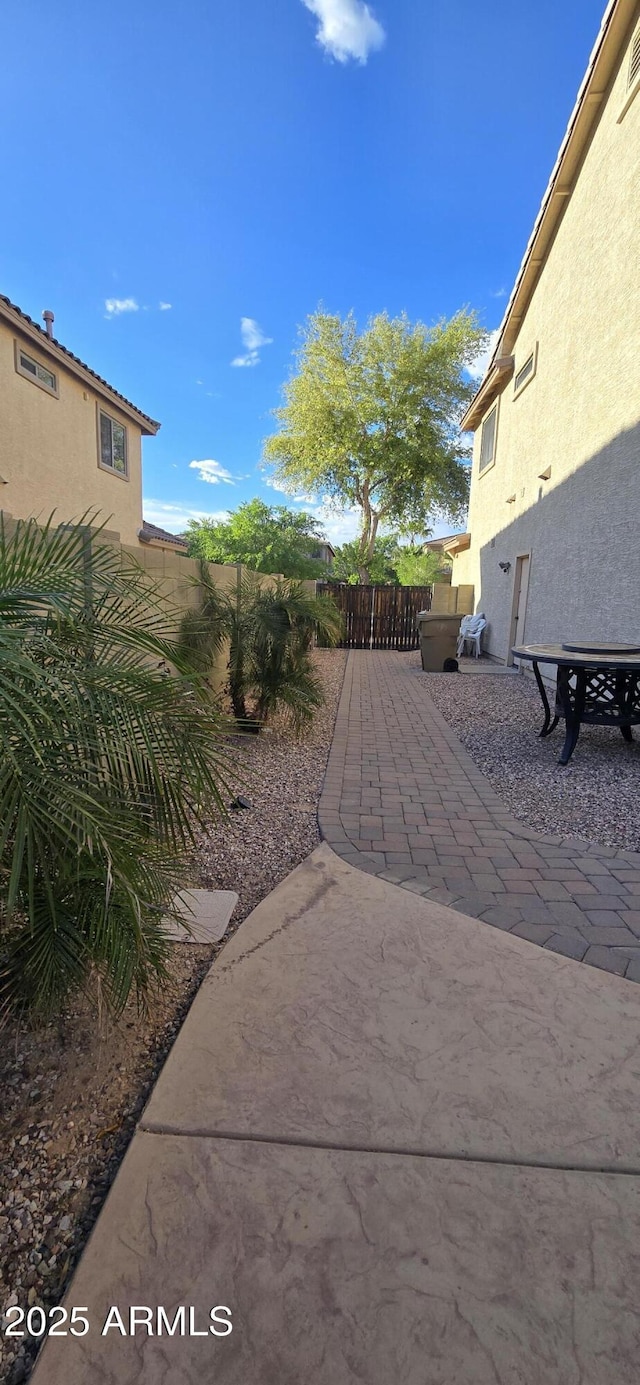 view of yard with a fenced backyard and a patio