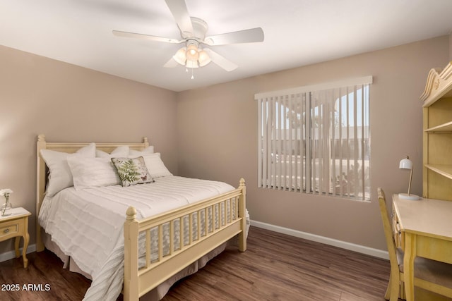 bedroom featuring dark wood-style floors, ceiling fan, and baseboards