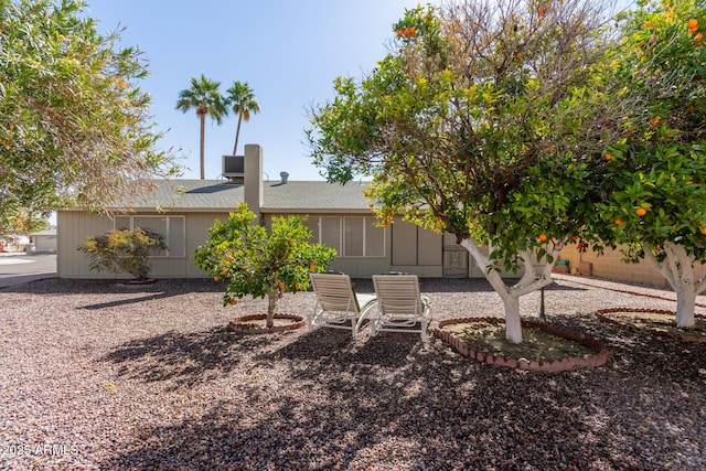 view of yard with central AC unit and fence