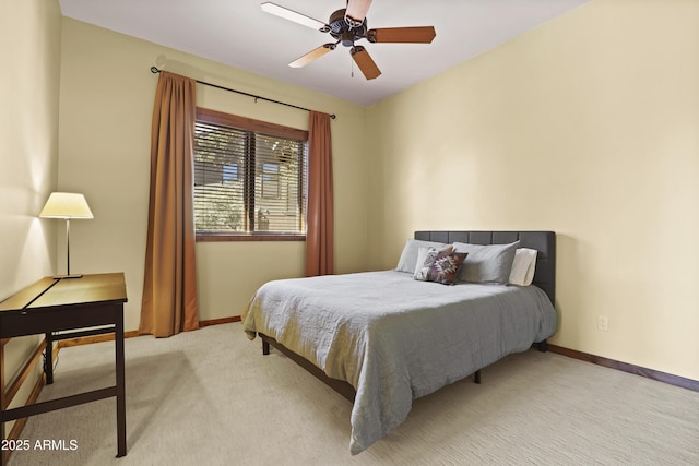 bedroom with ceiling fan and light carpet