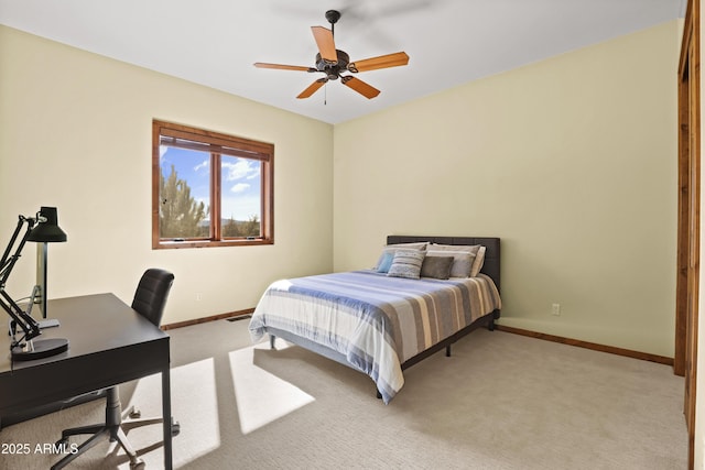 bedroom featuring ceiling fan and light colored carpet